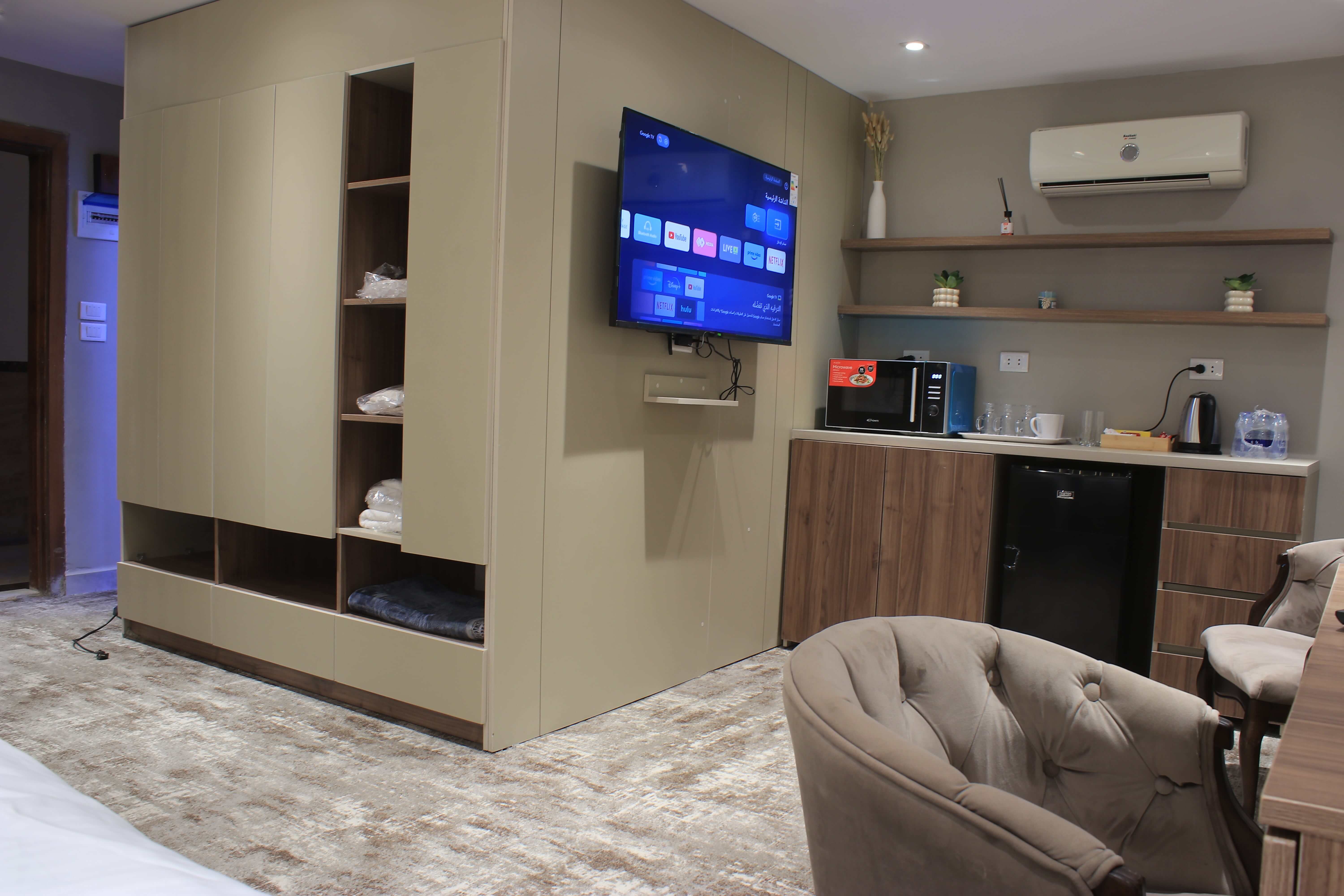 Guest Room with TV and Lounge Area